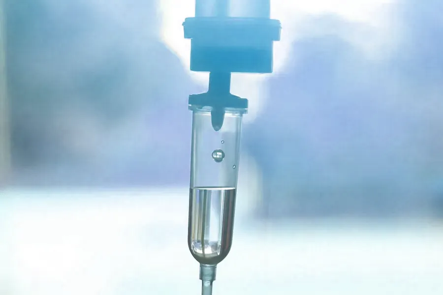 PIR-Insulin-Resensitization-Clinic Close-up of an IV drop in blue tones. Get PIR Insulin Resensitization Therapy from Richard Conlen, MD, FACOG in Boca Raton.